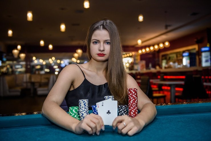 Sic Bo live studio with three dice cup and betting layout